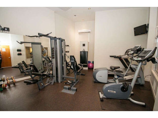 Furnished gym with cardio machines and free weights. - 1105 - 175 West 2nd Street, North Vancouver