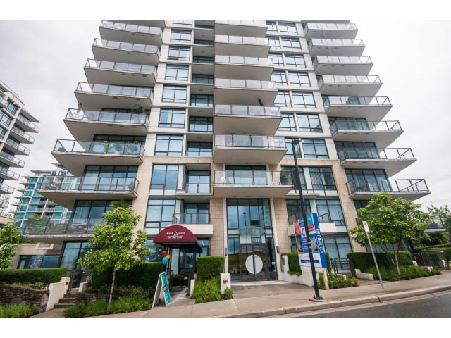 Furnished 1-bedroom condo with modern balcony design and city views. - 203 - 162 Victory Ship Way, North Vancouver