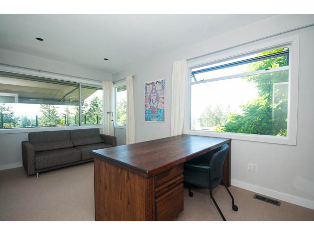 Bright living room with city view and modern furniture. - 6190 Candia Place, West Vancouver