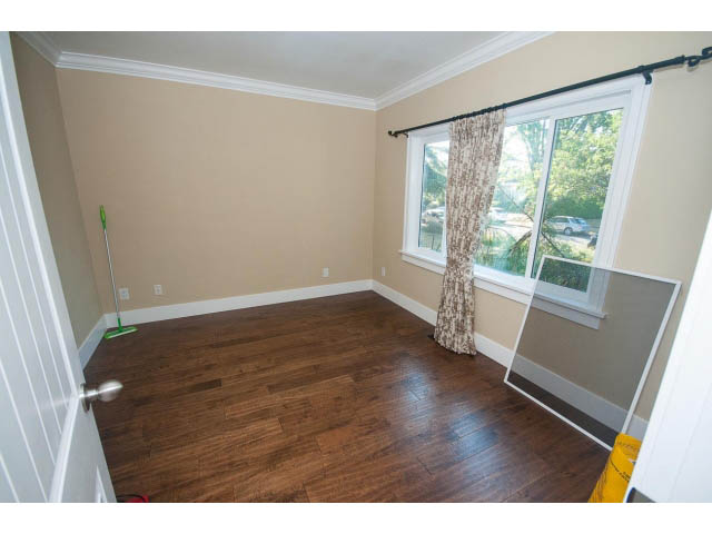 Spacious living room with hardwood floors and large windows. - 2939 West 30th Ave, Vancouver West Side