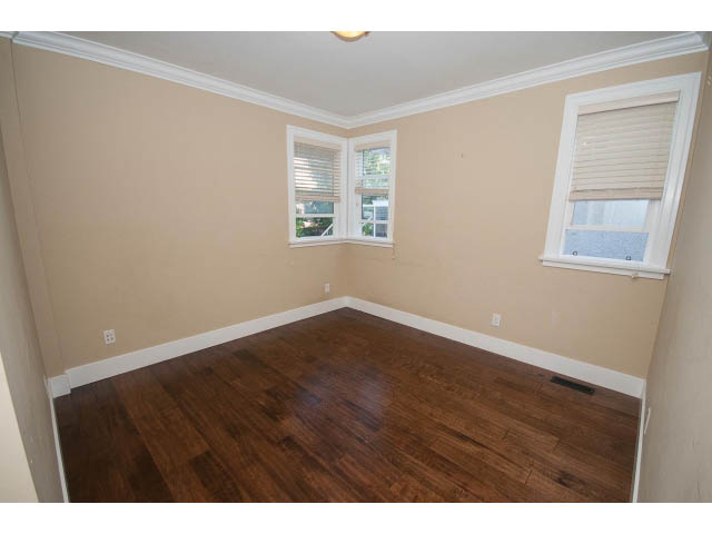 Bright living room with hardwood floors and large windows. - 2939 West 30th Ave, Vancouver West Side