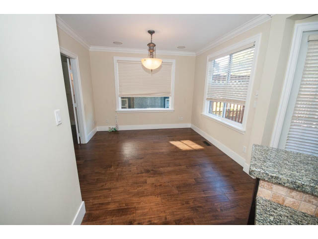 Bright kitchen with granite countertops and hardwood floors. - 2939 West 30th Ave, Vancouver West Side