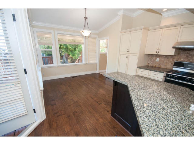 Bright kitchen with granite countertops and hardwood floors. - 2939 West 30th Ave, Vancouver West Side