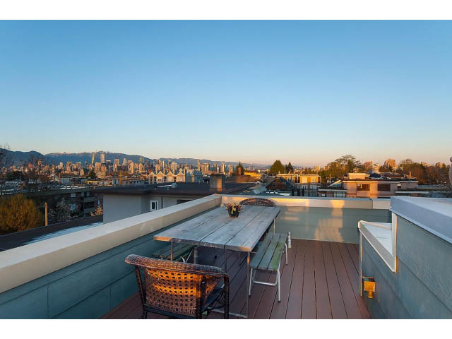 Furnished rooftop patio with city view and wooden deck. - 402 - 2252 West 5th Ave, Vancouver West Side