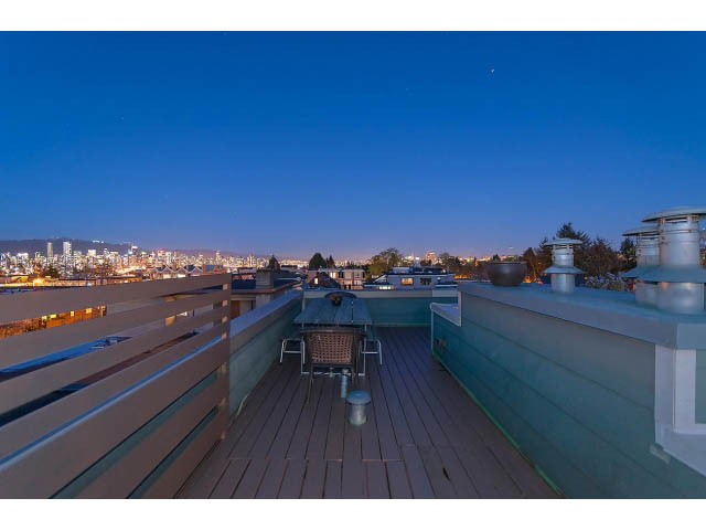 Furnished rooftop patio with city view and wooden deck. - 402 - 2252 West 5th Ave, Vancouver West Side