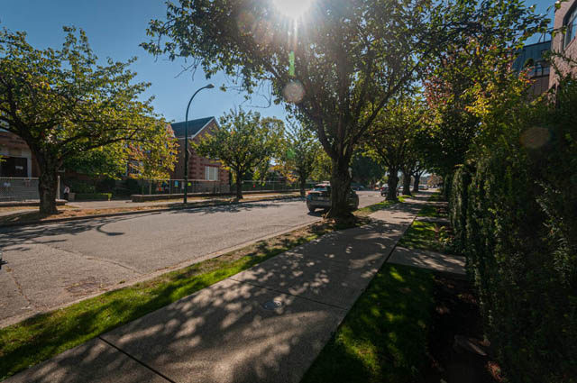 Furnished living room with hardwood floors and a city view. - 2753 Guelph Street, Vancouver East Side