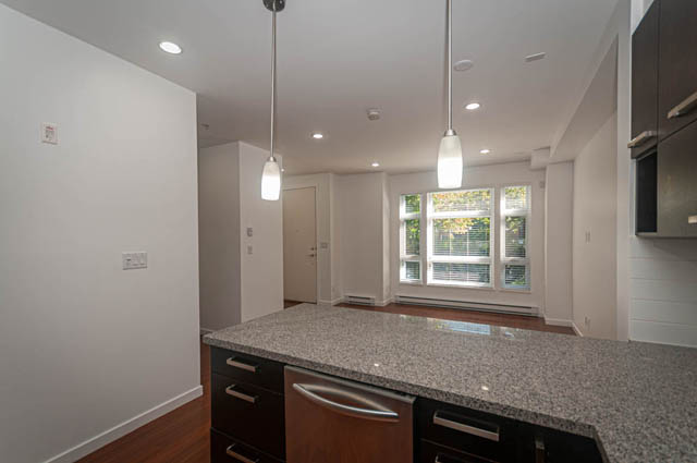 Bright kitchen with granite countertops and hardwood floors. - 2753 Guelph Street, Vancouver East Side