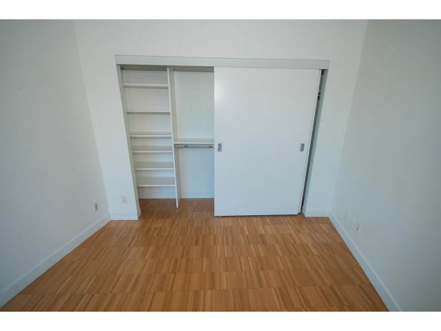 Bright hallway leading to a closet with sliding doors and hardwood floors. - 803 - 128 Cordova St W, Vancouver Downtown