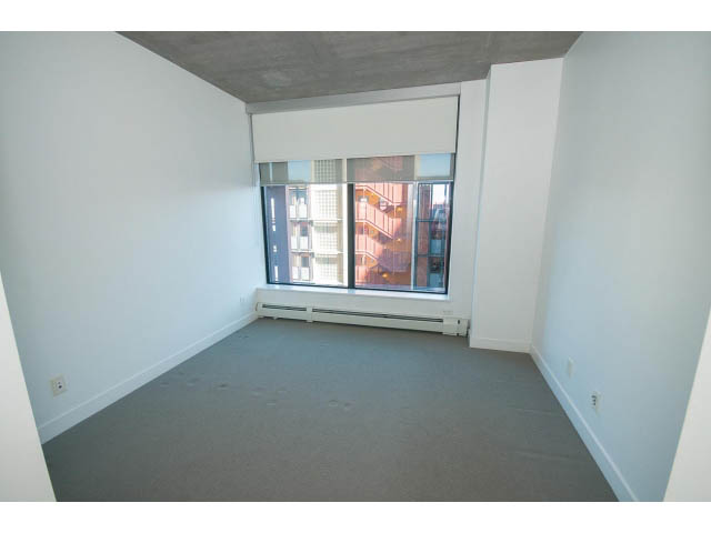 Bright living room with large windows and city view. - 803 - 128 Cordova St W, Vancouver Downtown