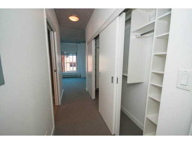 Spacious walk-in closet with built-in shelves and sliding doors. - 803 - 128 Cordova St W, Vancouver Downtown