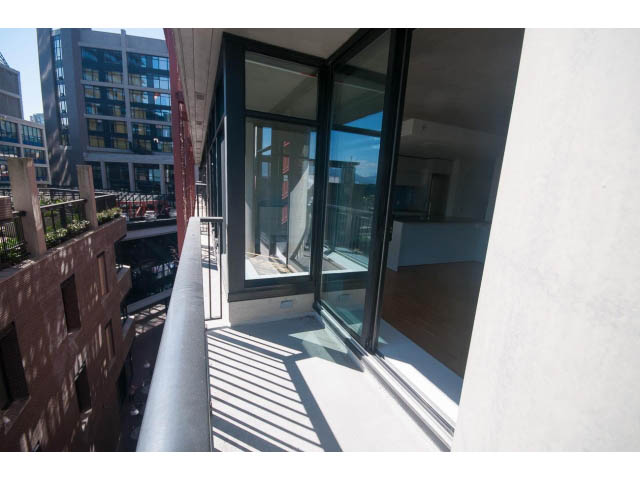 Bright balcony with sliding glass doors, city view, modern design. - 803 - 128 Cordova St W, Vancouver Downtown