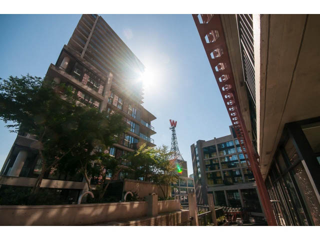 Furnished living room with city view and modern decor. - 803 - 128 Cordova St W, Vancouver Downtown