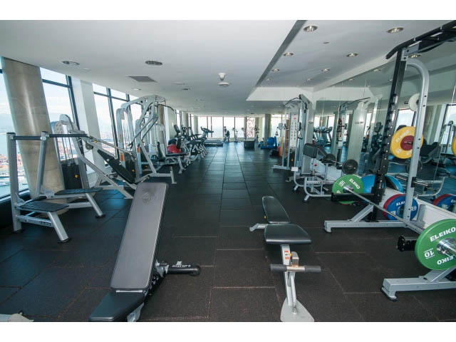 Spacious gym with cardio machines and weightlifting equipment. - 803 - 128 Cordova St W, Vancouver Downtown