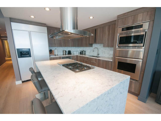 Bright kitchen with white marble countertops and hardwood floors. - 1702 - 1281 W. Cordova Street, Vancouver Downtown
