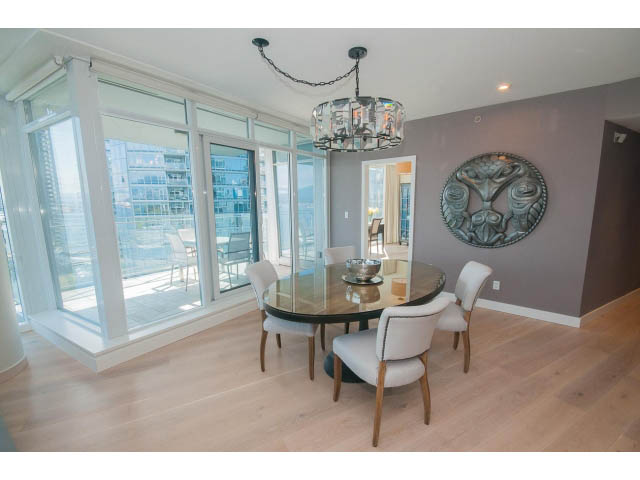Furnished dining area with hardwood floors, city view, and modern decor. - 1702 - 1281 W. Cordova Street, Vancouver Downtown