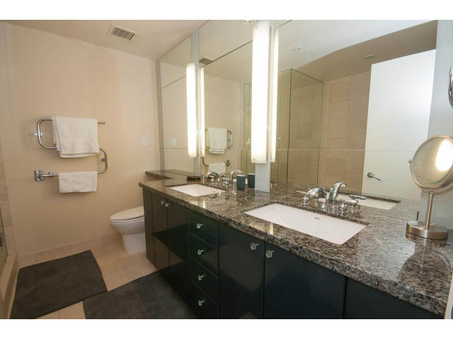 Bathroom with granite countertops, modern fixtures, and a large mirror. - 1702 - 1281 W. Cordova Street, Vancouver Downtown
