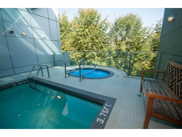 Spacious balcony with a hot tub and lounge chairs, overlooking a lush green space. - 1702 - 1281 W. Cordova Street, Vancouver Downtown