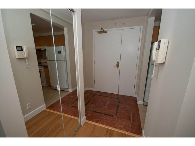 Furnished kitchen with hardwood floors and marble countertop. - 707 - 1288 Marinaside Crescent, Vancouver Downtown