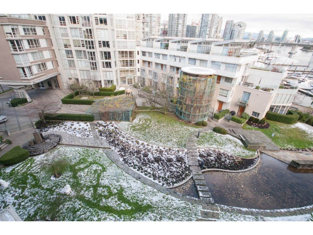 Bright living room with city view and snow-covered garden. - 707 - 1288 Marinaside Crescent, Vancouver Downtown