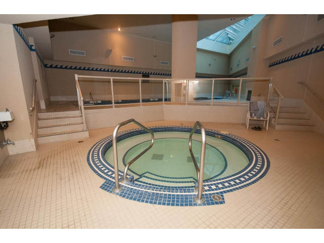 Spacious, well-lit indoor pool area with tiled floors and handrails. - 707 - 1288 Marinaside Crescent, Vancouver Downtown