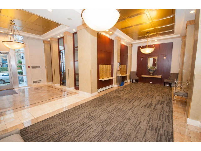 Furnished living room with marble floors and modern lighting fixtures. - 707 - 1288 Marinaside Crescent, Vancouver Downtown