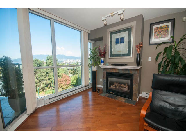 Bright living room with hardwood floors, city view, and modern decor. - 603 - 1425 West 6th Ave, Vancouver West Side