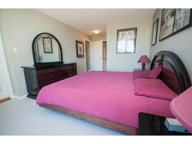 Furnished 2-bedroom + den with pink bedding and mirrored headboard. - 603 - 1425 West 6th Ave, Vancouver West Side