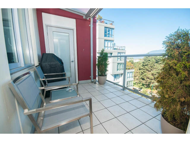 Furnished balcony with tiled floor, outdoor seating, and city view. - 603 - 1425 West 6th Ave, Vancouver West Side