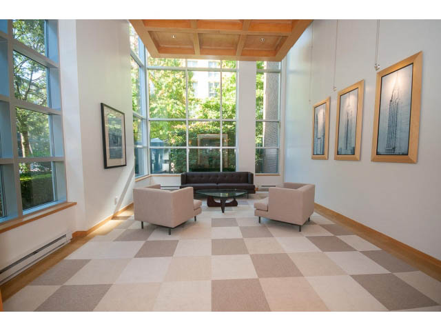 Bright living room with checkered floor, large windows, and modern furniture. - 603 - 1425 West 6th Ave, Vancouver West Side