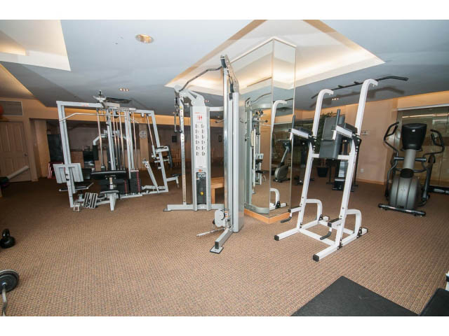 Furnished gym with weight machines and cardio equipment. - 603 - 1425 West 6th Ave, Vancouver West Side