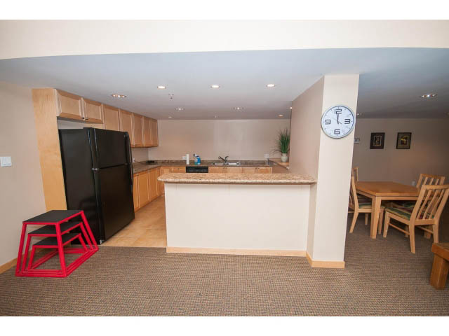Bright kitchen with granite countertops, hardwood floors, and a dining area. - 603 - 1425 West 6th Ave, Vancouver West Side