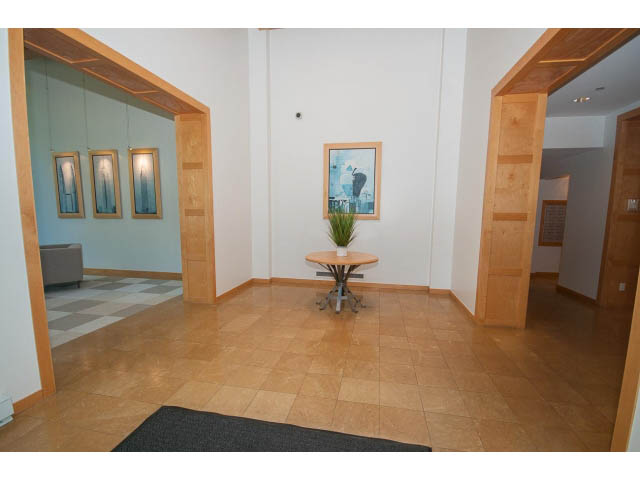 Furnished living room with hardwood floors and modern decor. - 603 - 1425 West 6th Ave, Vancouver West Side