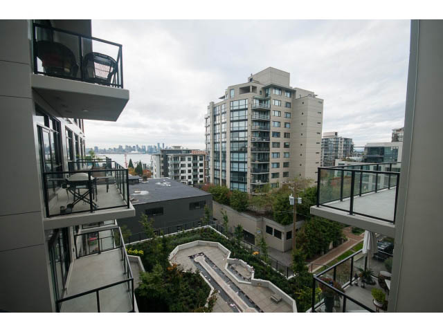 Furnished 1-bedroom balcony with city view and modern furnishings. - 405 - 105 West 2nd St, North Vancouver