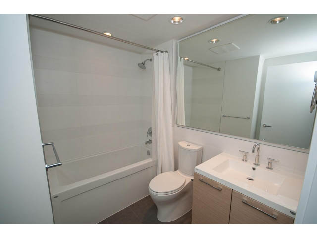 Bright bathroom with white countertop and modern fixtures. - 9 - 3508 Mount Seymour Pkwy, North Vancouver