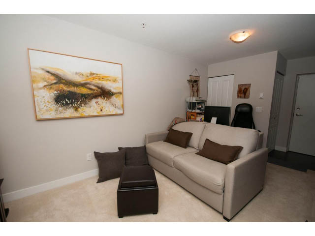 Furnished living room with modern furniture, abstract wall art, and neutral tones. - 4539 Prince Albert Street, Vancouver East Side