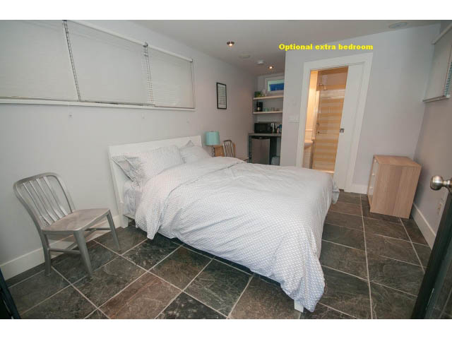 Bright bedroom with tiled floor and built-in shelves, perfect for a guest room. - Upper - 817 Union St, Vancouver East Side