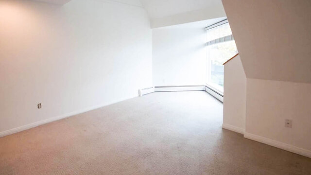 Bright carpeted bedroom with white walls and a large window flooding the space with natural light. - 13-870 West 7th Avenue, Vancouver West Side