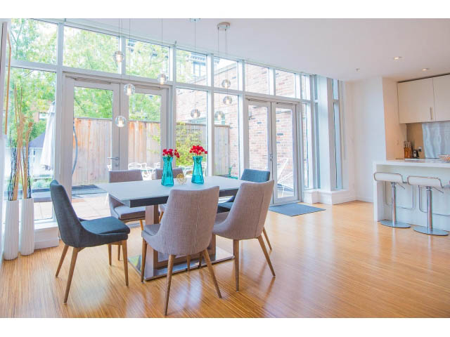 Bright dining area with modern chairs, hardwood floors, and large windows. - 509 - 36 Water Street, Vancouver Downtown