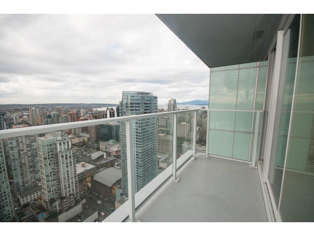 Furnished balcony with city view and glass railings. - 4609 - 777 Richards St, Vancouver Downtown