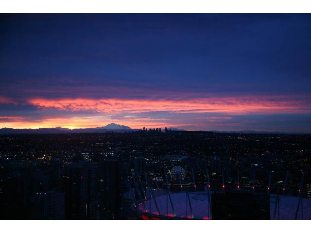 Furnished 2-bedroom condo with stunning city view at dusk. - 4609 - 777 Richards St, Vancouver Downtown