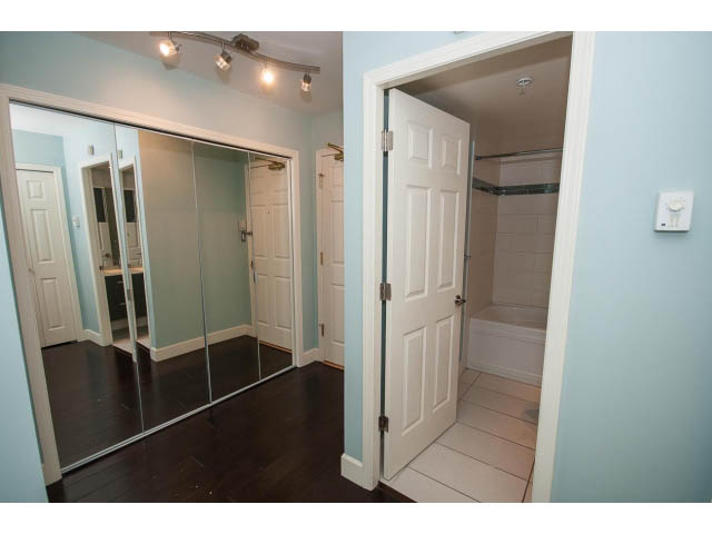 Spacious bedroom with mirrored closet and hardwood floors. - 706 - 1088 Quebec St., Vancouver East Side