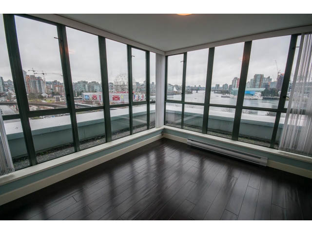 Spacious living room with hardwood floors and panoramic city view. - 706 - 1088 Quebec St., Vancouver East Side