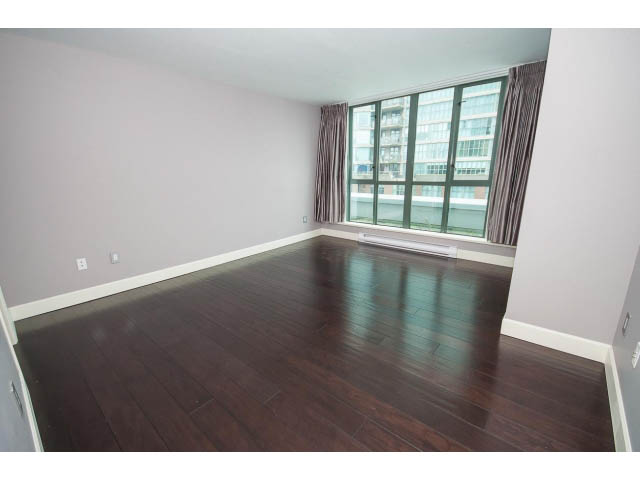 Bright living room with hardwood floors and city view. - 706 - 1088 Quebec St., Vancouver East Side