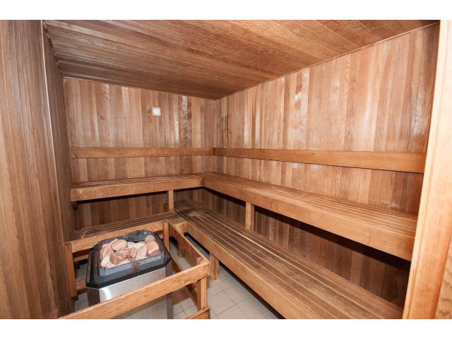 Furnished sauna with wooden benches and a stone heater. - 706 - 1088 Quebec St., Vancouver East Side