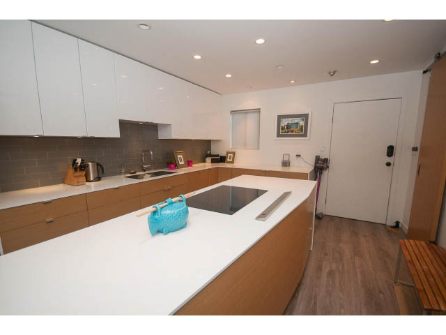 Bright kitchen with white countertops and hardwood floors, modern design. - 15 - 2151 Banbury Rd, North Vancouver