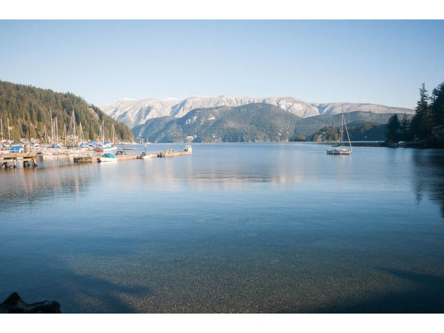 Furnished living room with a view of the lake and mountains. - 15 - 2151 Banbury Rd, North Vancouver
