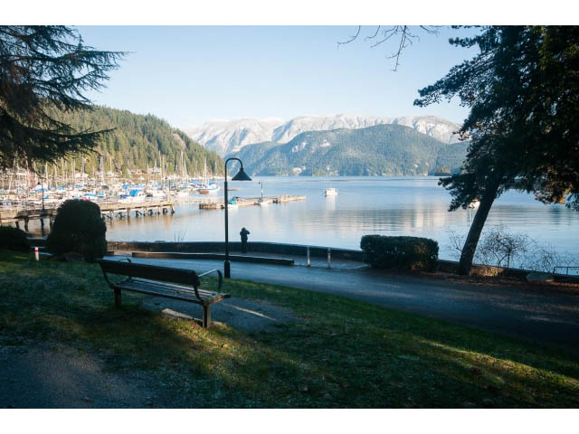 Furnished living room with waterfront view and dock. - 15 - 2151 Banbury Rd, North Vancouver
