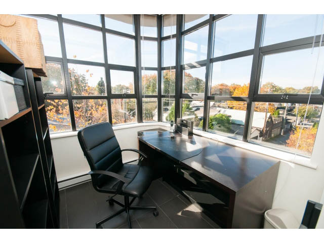 Bright and airy penthouse living room with large windows, city view, and modern furniture. - 401 - 2828 Yew St, Vancouver West Side