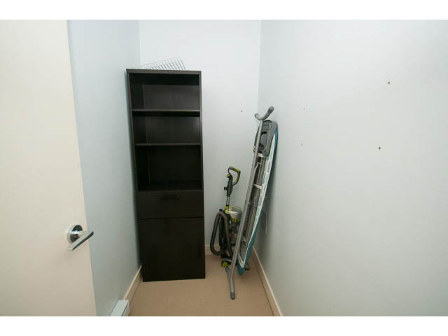 Storage area with shelves and vacuum cleaner, neat and organized. - 401 - 2828 Yew St, Vancouver West Side