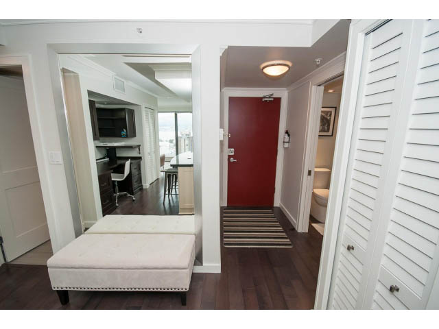 Furnished living room with hardwood floors and city view. - 2407 - 1723 Alberni, Vancouver Downtown